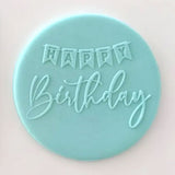 Happy Birthday banner pattern from debosser on round circle of blue icing