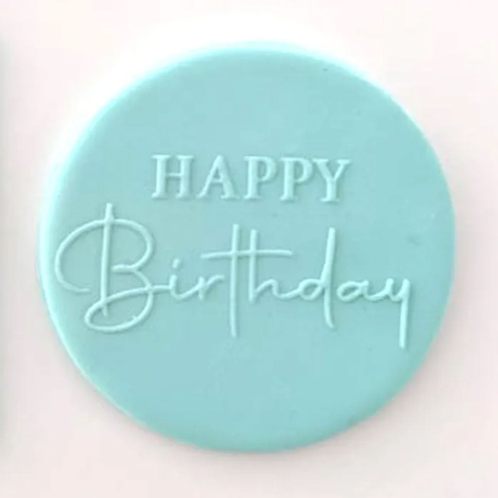 happy birthday script pattern from debosser on round circle of blue icing