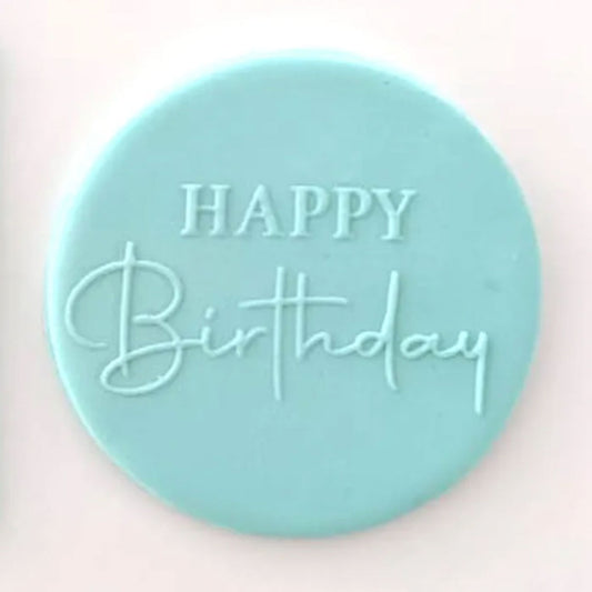 happy birthday script pattern from debosser on round circle of blue icing