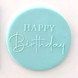 happy birthday script pattern from debosser on round circle of blue icing
