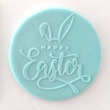 happy easter with bunny ears pattern from debosser on round circle of blue fondant