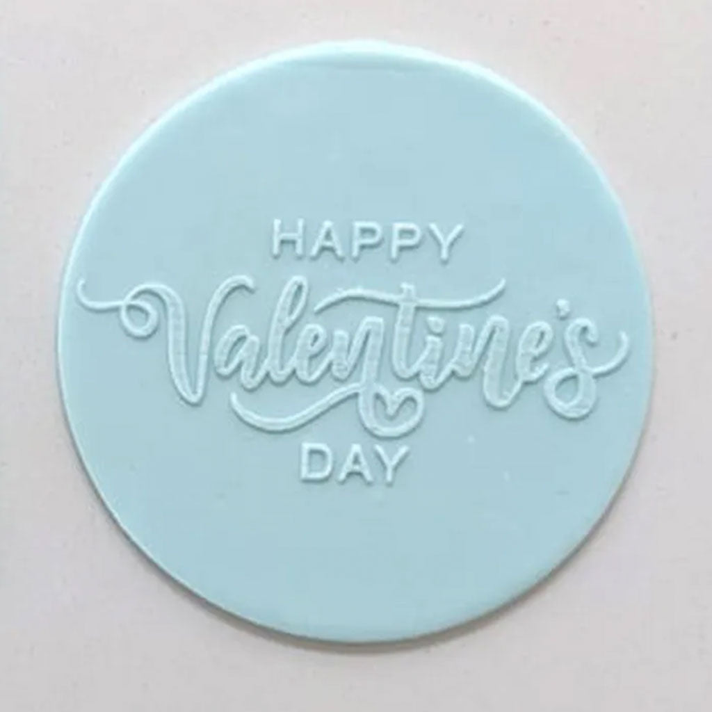 happy Valentine's Day pattern from debosser on round circle of blue icing