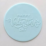 happy Valentine's Day pattern from debosser on round circle of blue icing