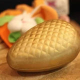 Gold chocolate Easter egg with quilted pattern on top