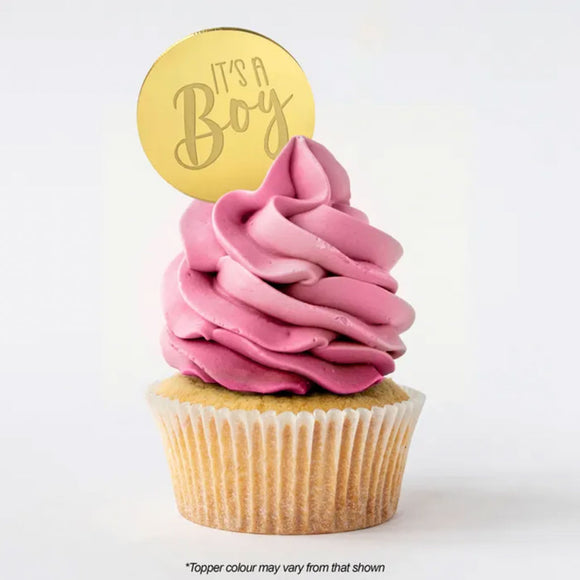 Round It's A Boy gold mirror topper on cupcake with pink buttercream icing
