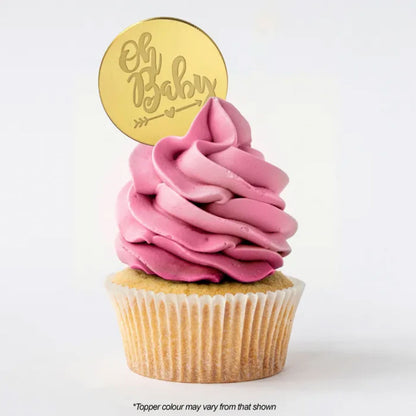 Round Oh Baby gold mirror topper on cupcake with pink buttercream icing