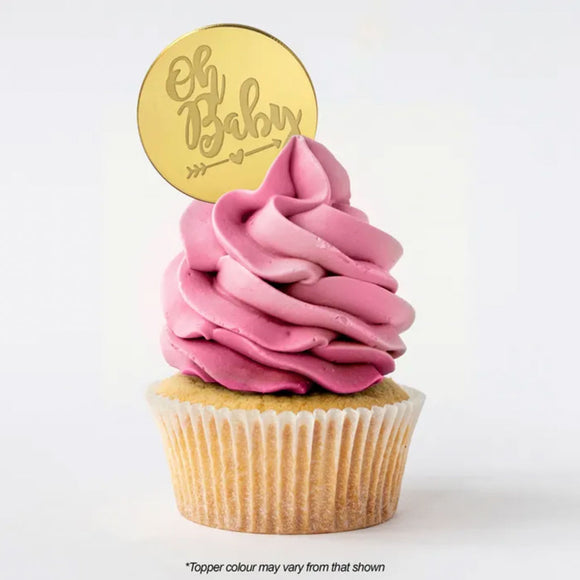 Round Oh Baby gold mirror topper on cupcake with pink buttercream icing