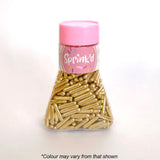 jar of shiny gold rod shaped sprinkles in jar with pink lid