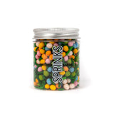 Sprinks Clear jar of speckled egg sprinkles and dark green jimmies with a screw top lid