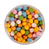 Speckled Egg Sprinkles in orange, yellow, green, blue, pink and white in round clear jar