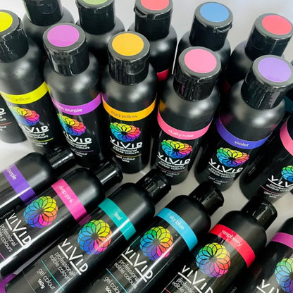 vivid large gel food colour bottles in all different shades standing and laying down